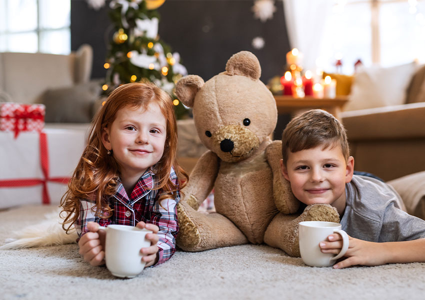 children on carpet during the holidays